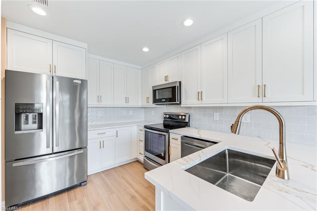 23151 Rosedale Drive, Unit 101 Estero, FL 34135 - Photo 7 of 20 New kitchen cabinets with quartz countertops