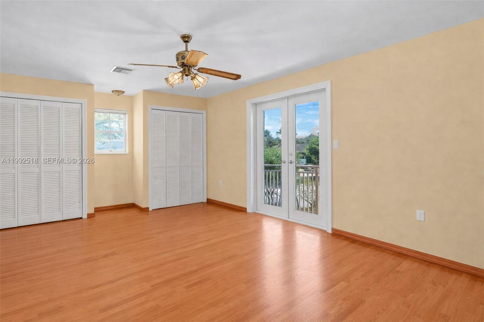 5309 Alton Road Miami Beach, FL 33140 - Photo 23 of 51 wooden floor in an empty room with a window