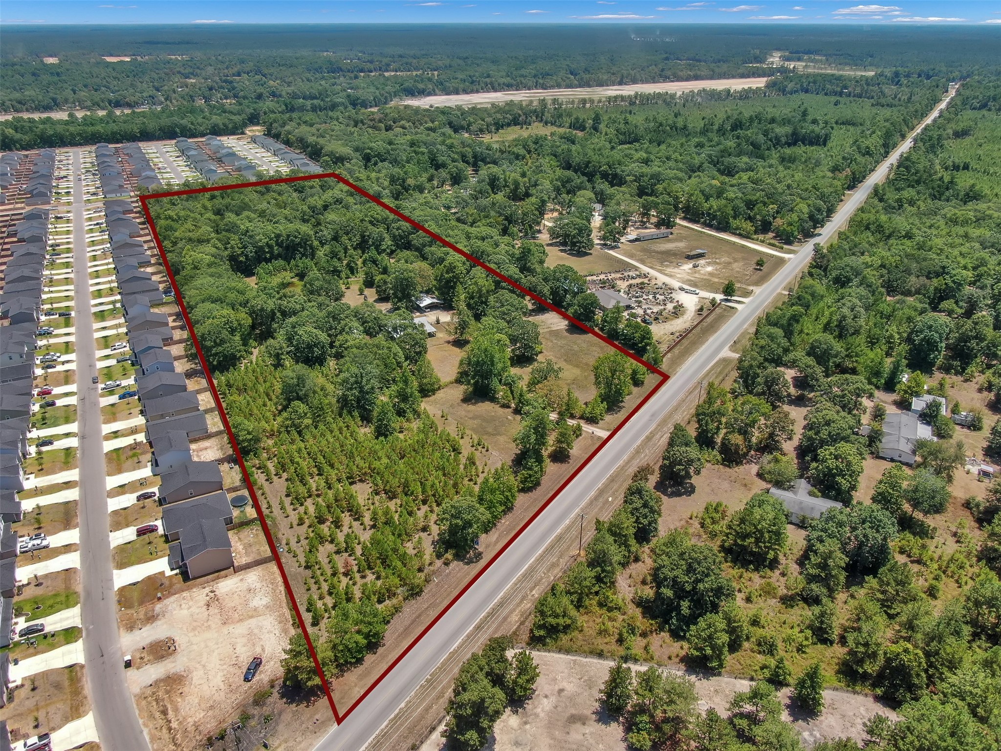 10173 Crockett Martin Road Conroe, TX 77306 - Photo 3 of 20 an aerial view of a residential houses covered with trees