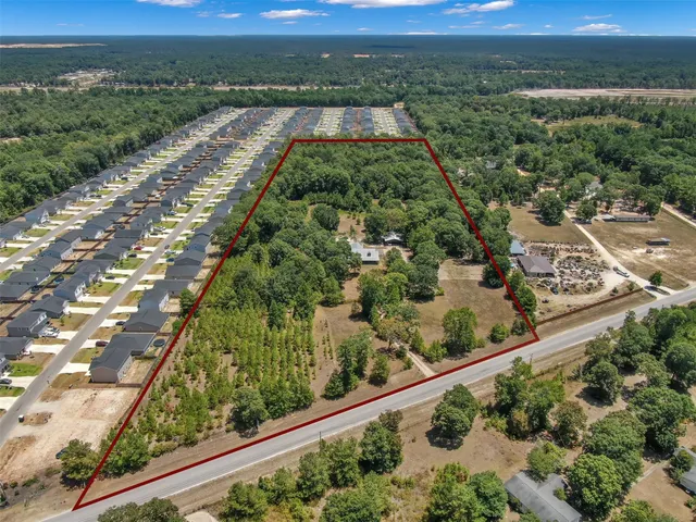 a view of a street with a flower garden