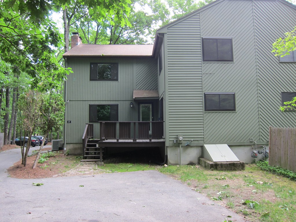 47 Mountain Gate Road, Unit 47 Ashland, MA 01721 - Photo 1 of 15 a view of a house with a yard