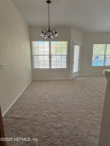 a view of an empty room and window