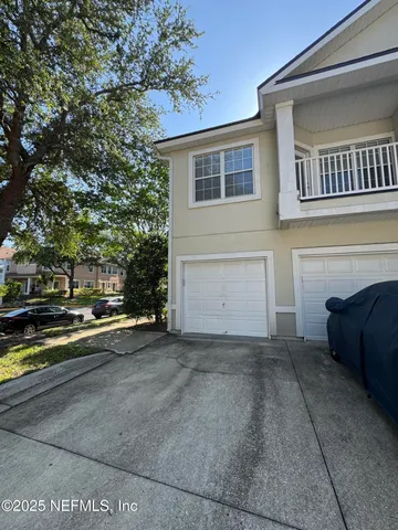 a view of a house with a couches and a fireplace