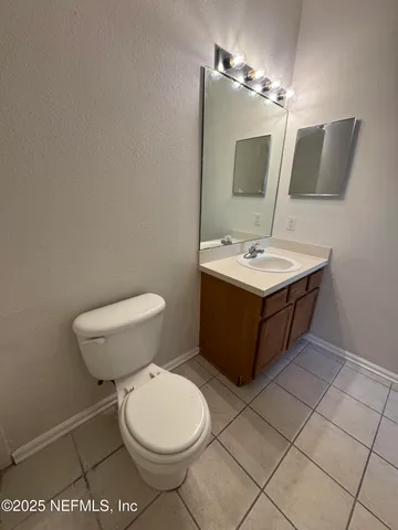 a large bathroom with a tub and double vanity sink