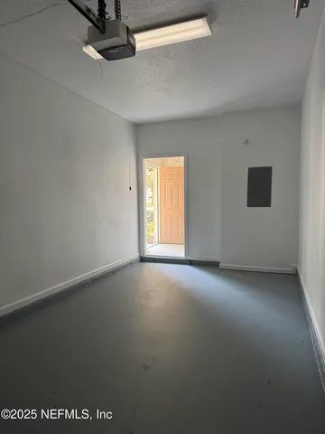 an empty room with a empty space and windows