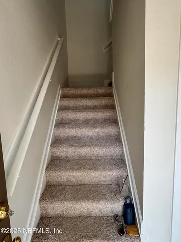 a view of an entryway with hallway