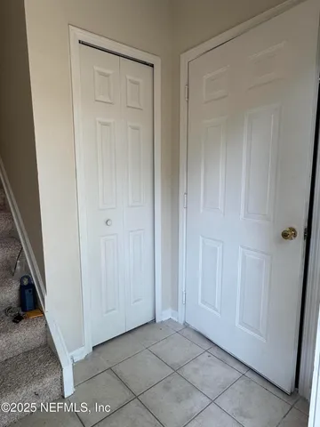 a view of a big room with closet and wooden floor