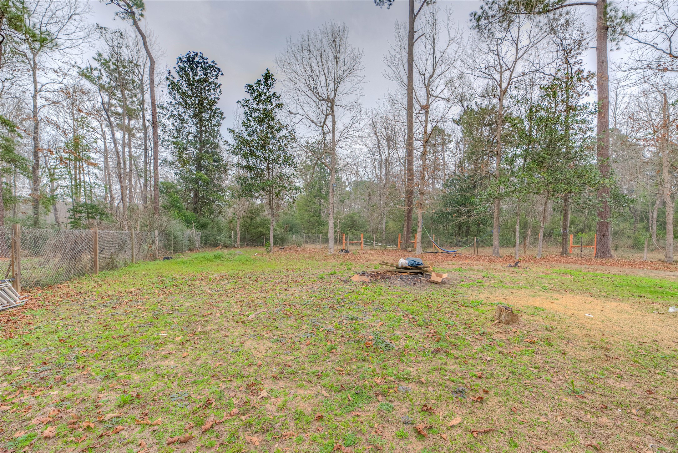 713 Garrett Road Livingston, TX 77351 - Photo 21 of 40 a view of a backyard with large trees