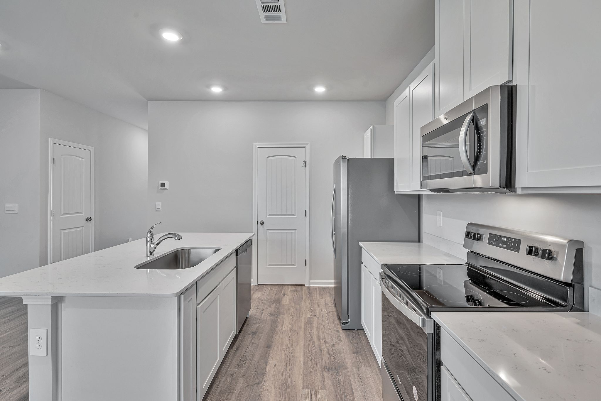 242 Hazel Lane Lebanon, TN 37087 - Photo 4 of 18 a kitchen that has a sink a stove and stainless steel appliances