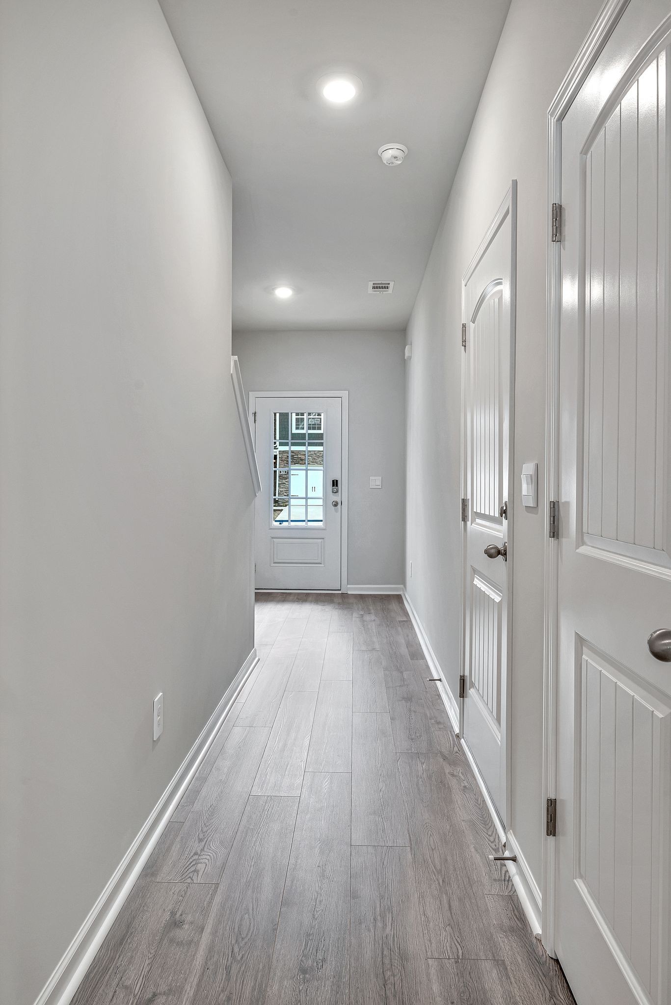 242 Hazel Lane Lebanon, TN 37087 - Photo 7 of 18 wooden floor in an empty room with a window
