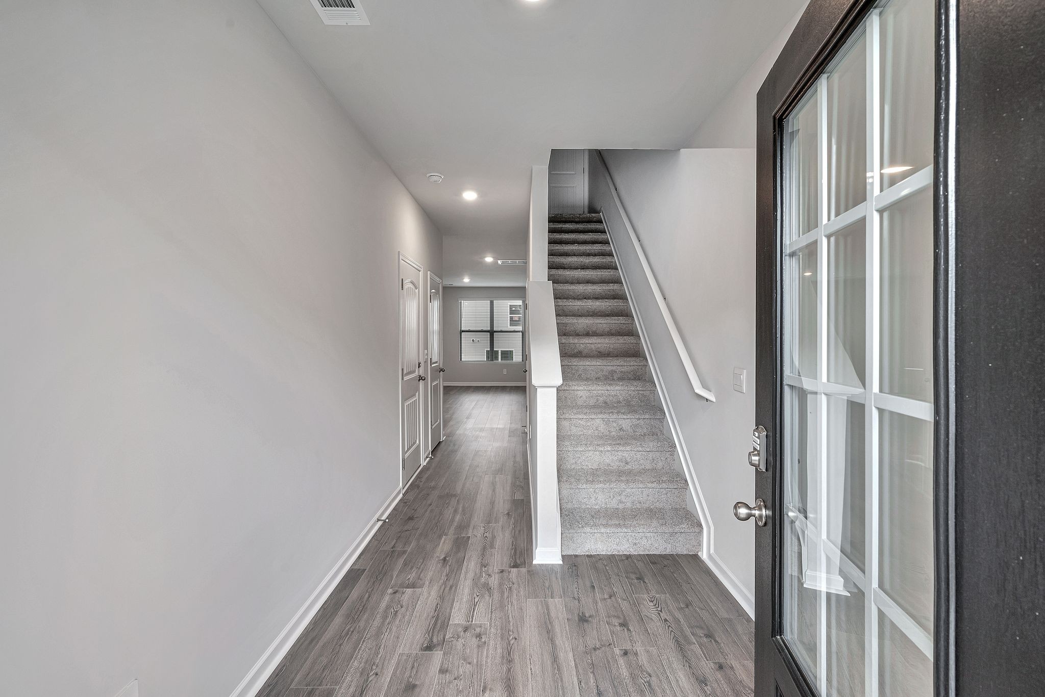 242 Hazel Lane Lebanon, TN 37087 - Photo 8 of 18 a view of a hallway with wooden floor and entryway