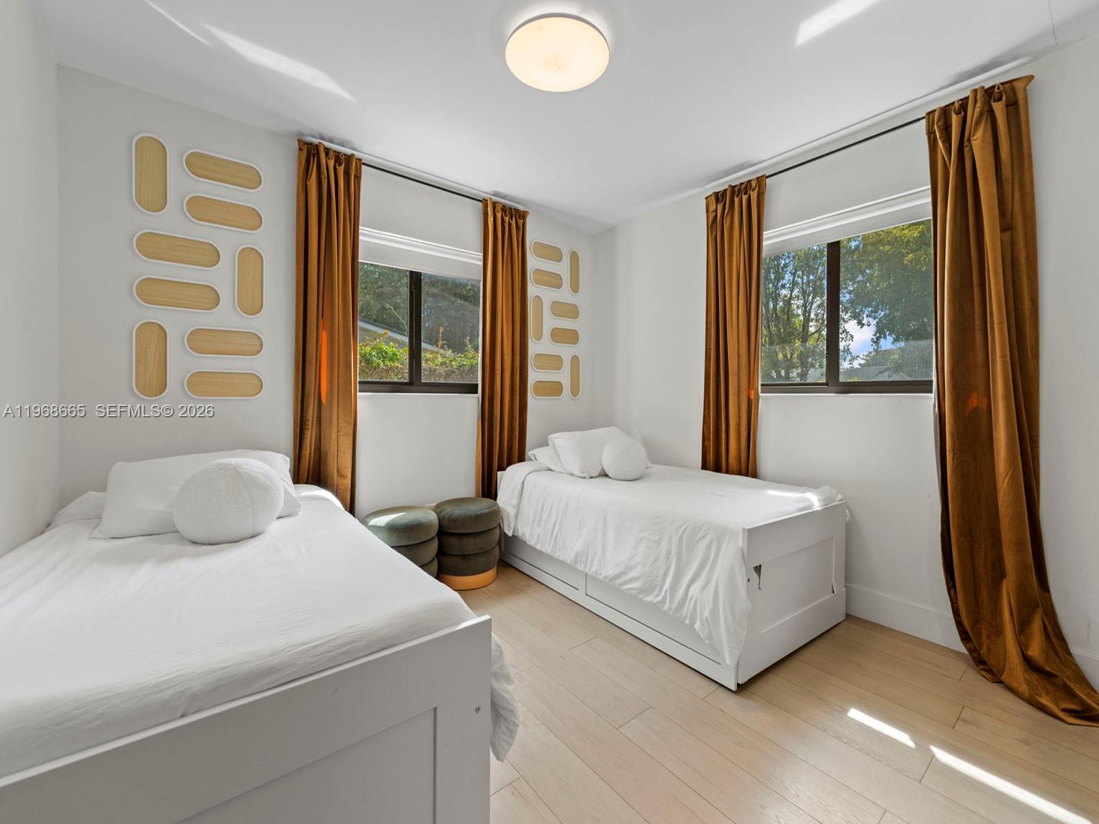 7731 Southwest 18th Terrace Miami, FL 33155 - Photo 24 of 50 a bedroom with a bed and a large window