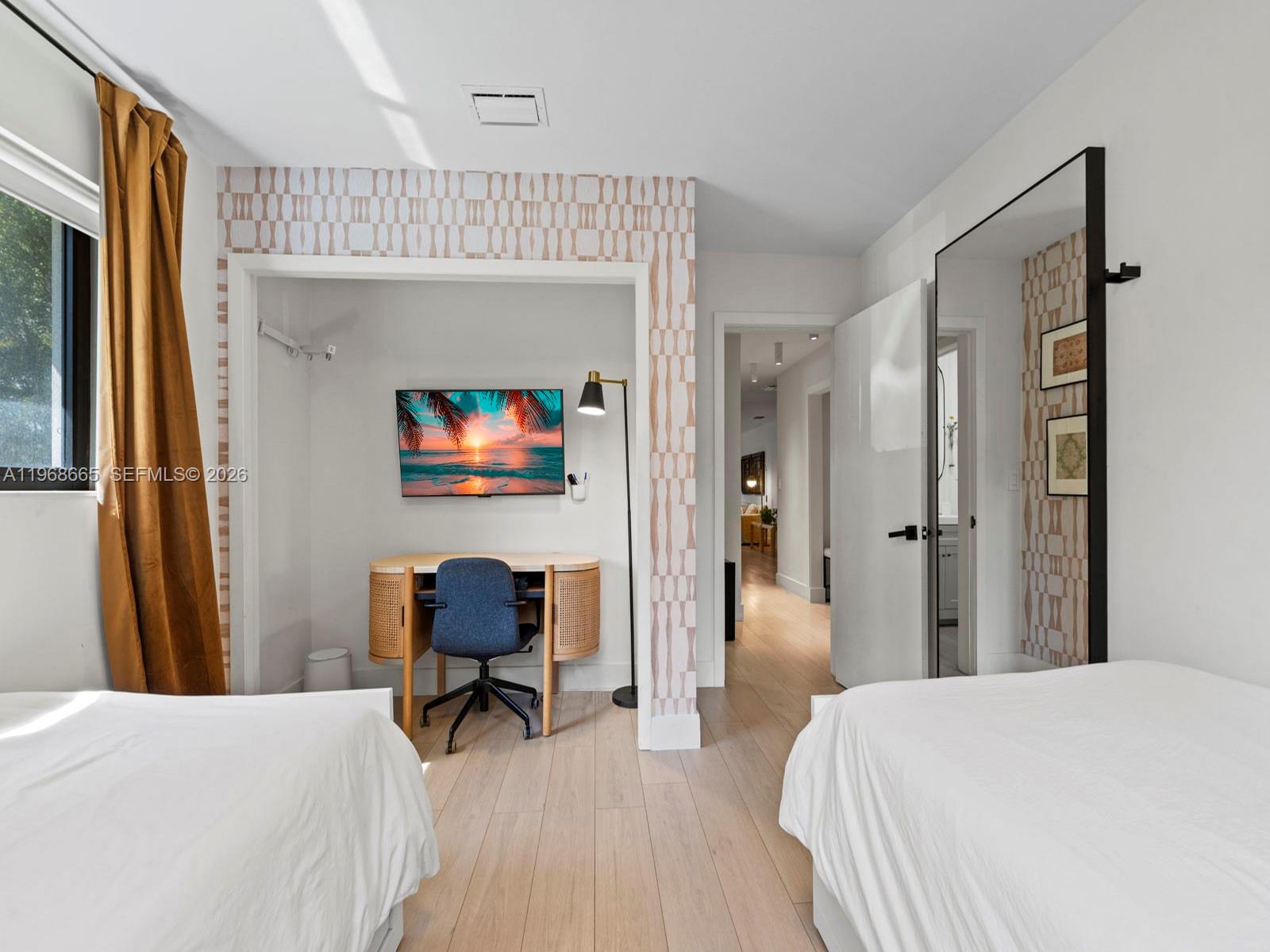 7731 Southwest 18th Terrace Miami, FL 33155 - Photo 25 of 50 a bedroom with a bed and a chair