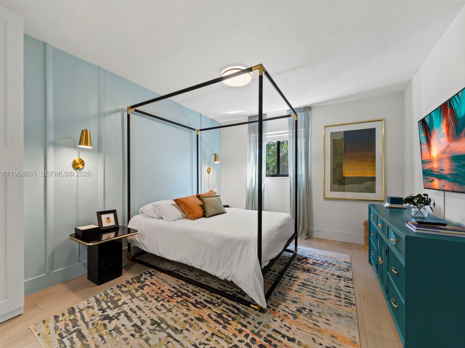 7731 Southwest 18th Terrace Miami, FL 33155 - Photo 26 of 50 a bedroom with a bed and a flat screen tv