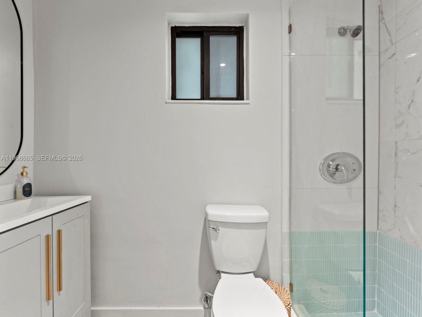 7731 Southwest 18th Terrace Miami, FL 33155 - Photo 34 of 50 a bathroom with a toilet sink and shower