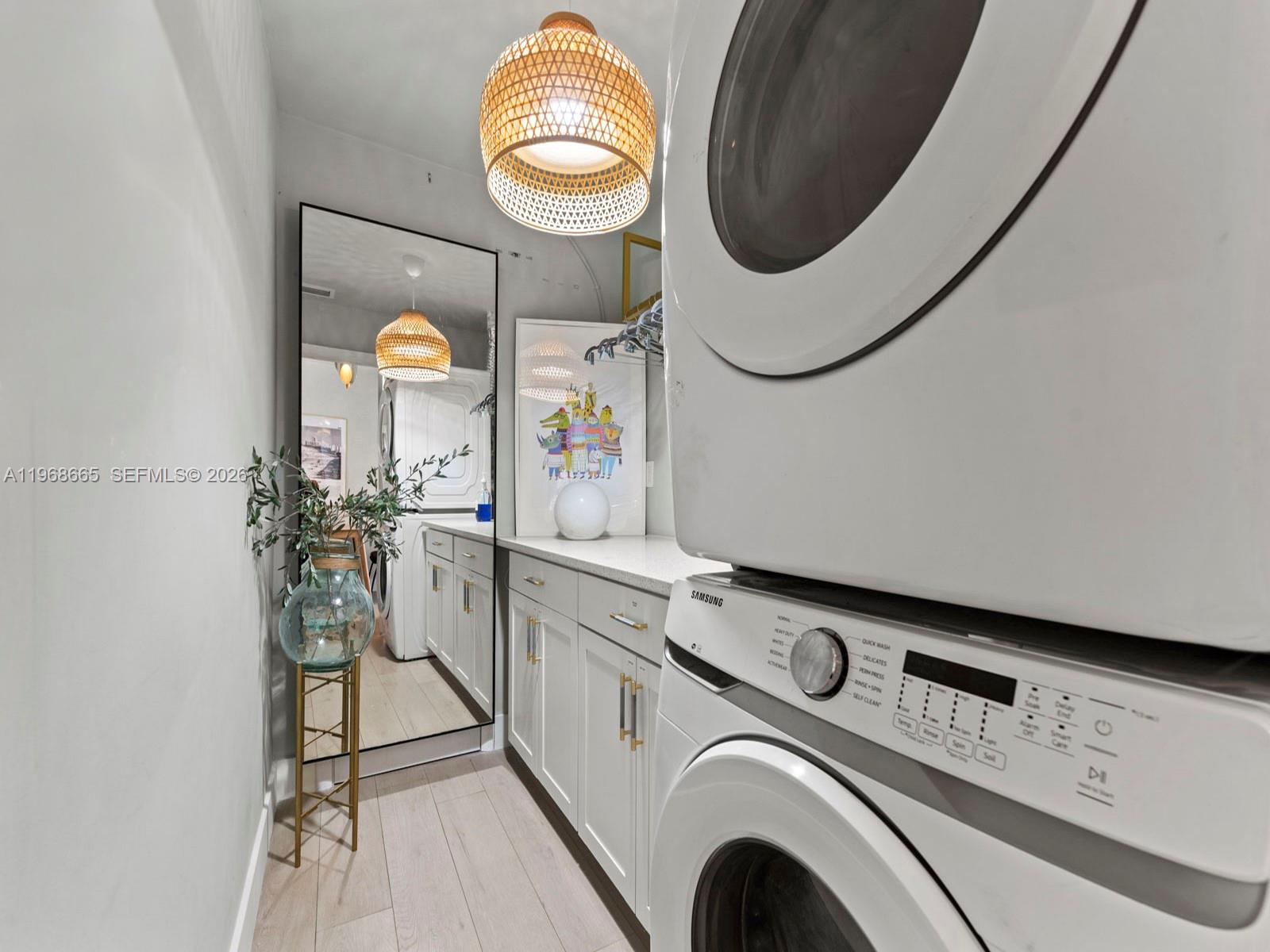 7731 Southwest 18th Terrace Miami, FL 33155 - Photo 36 of 50 a utility room with dryer and washer