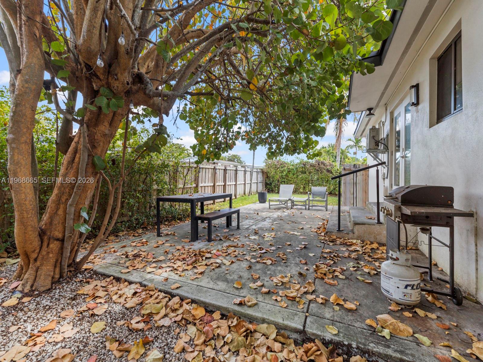 7731 Southwest 18th Terrace Miami, FL 33155 - Photo 38 of 50 a bench sitting in the middle of a yard