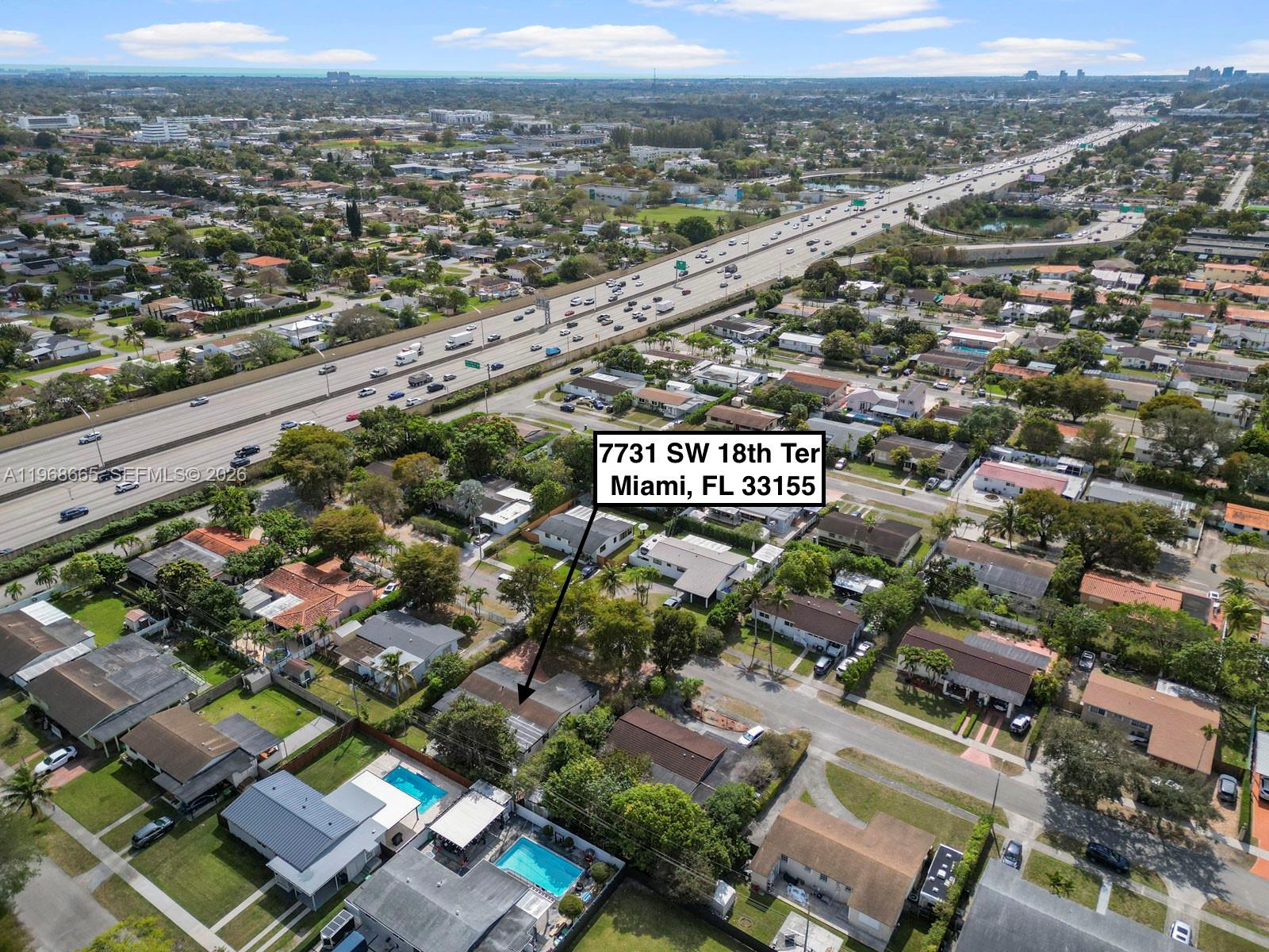 7731 Southwest 18th Terrace Miami, FL 33155 - Photo 48 of 50 an aerial view of a city with streets