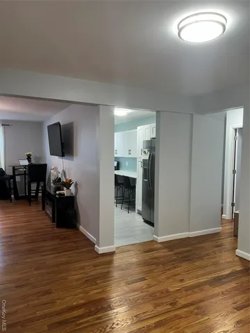 a kitchen with stainless steel appliances a refrigerator and cabinets