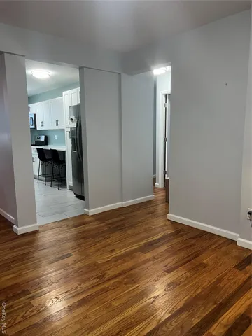 a kitchen with stainless steel appliances a refrigerator and a stove top oven