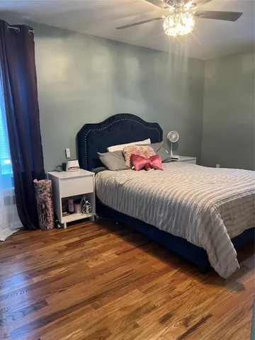 a bed room with a bed and a television