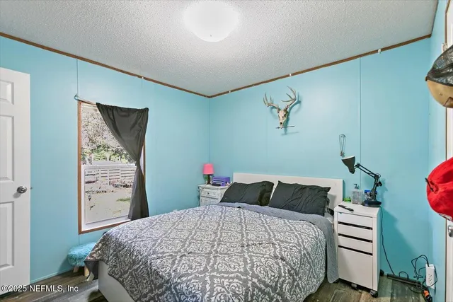 a bedroom with a bed and cabinets