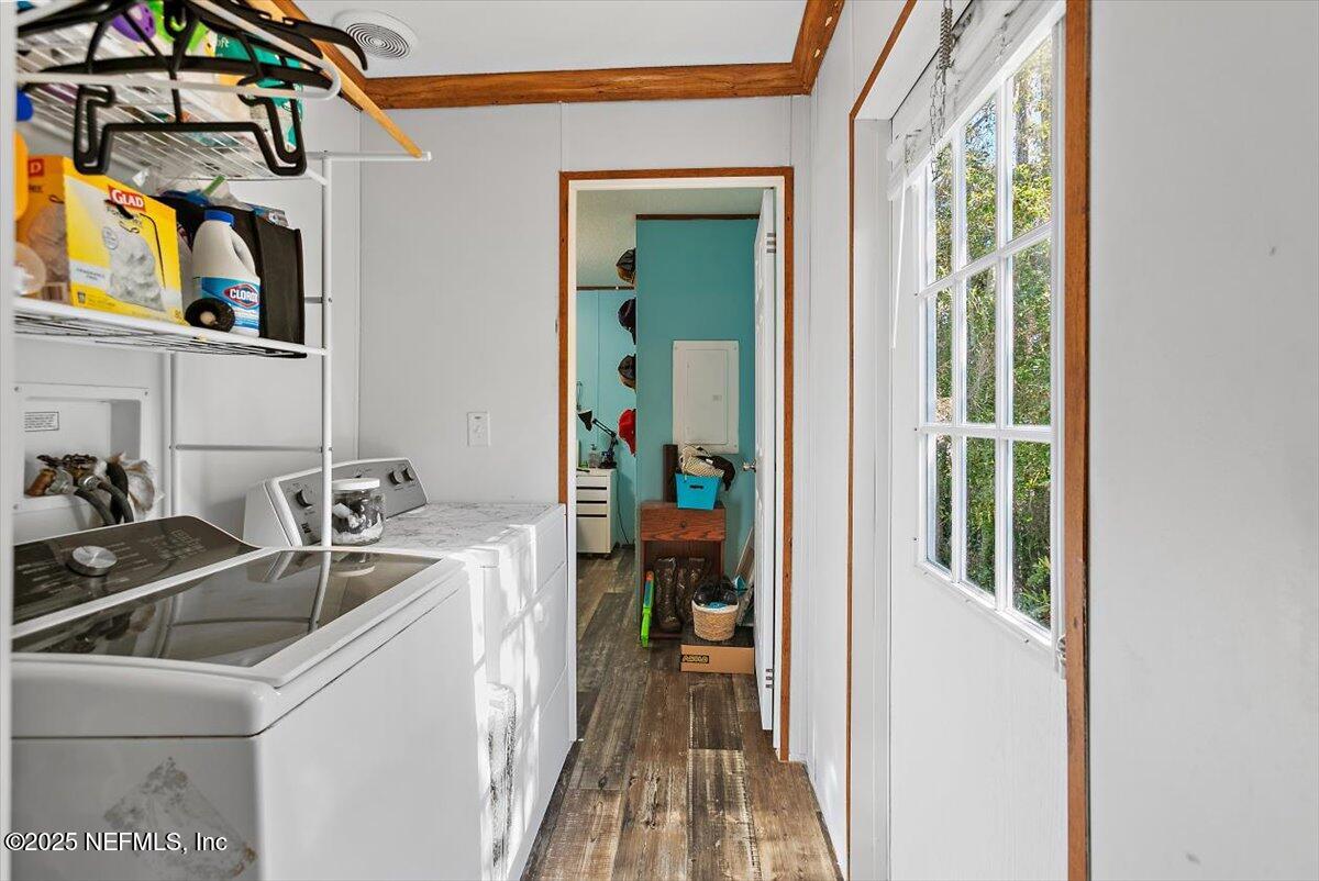 2670 Pleasure Lane St. Augustine, FL 32084 - Photo 10 of 12 a kitchen with a sink and a refrigerator
