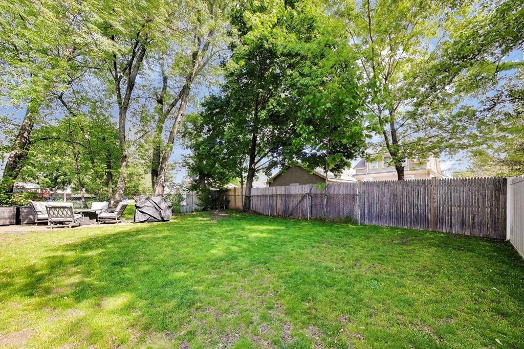 22 Douglas Road Ashland, MA 01721 - Photo 24 of 24 a view of a backyard with sitting area