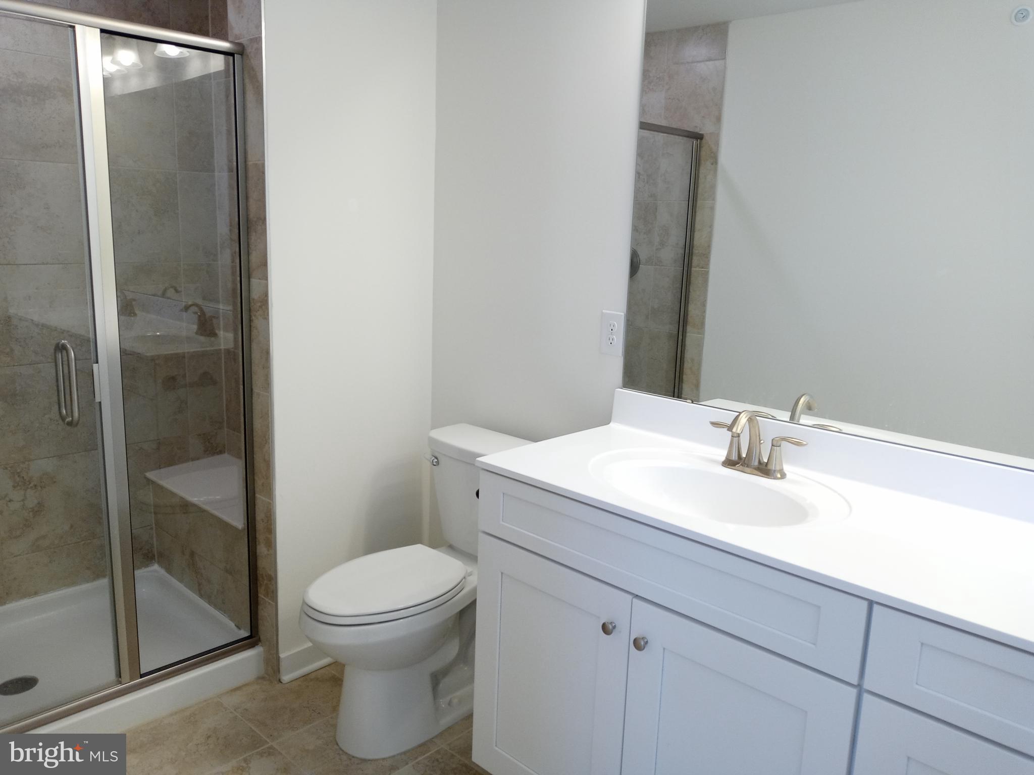1908 Boulder Drive Downingtown, PA 19335 - Photo 20 of 27 a bathroom with a sink a toilet and shower