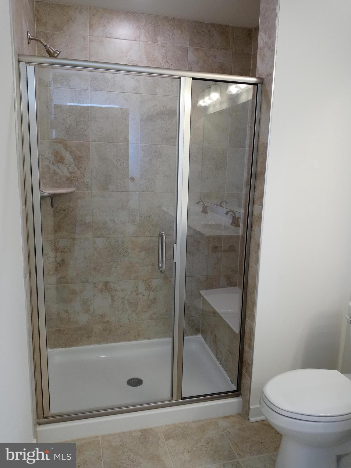 1908 Boulder Drive Downingtown, PA 19335 - Photo 21 of 27 a bathroom with a glass shower door