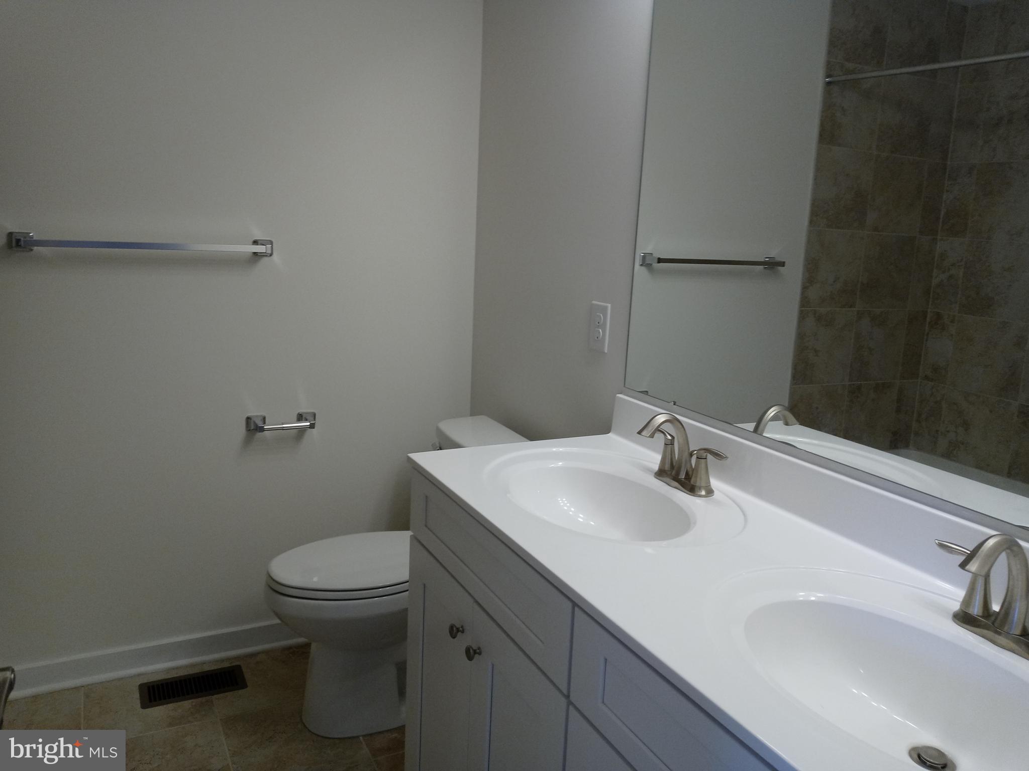 1908 Boulder Drive Downingtown, PA 19335 - Photo 24 of 27 a bathroom with a sink toilet and vanity
