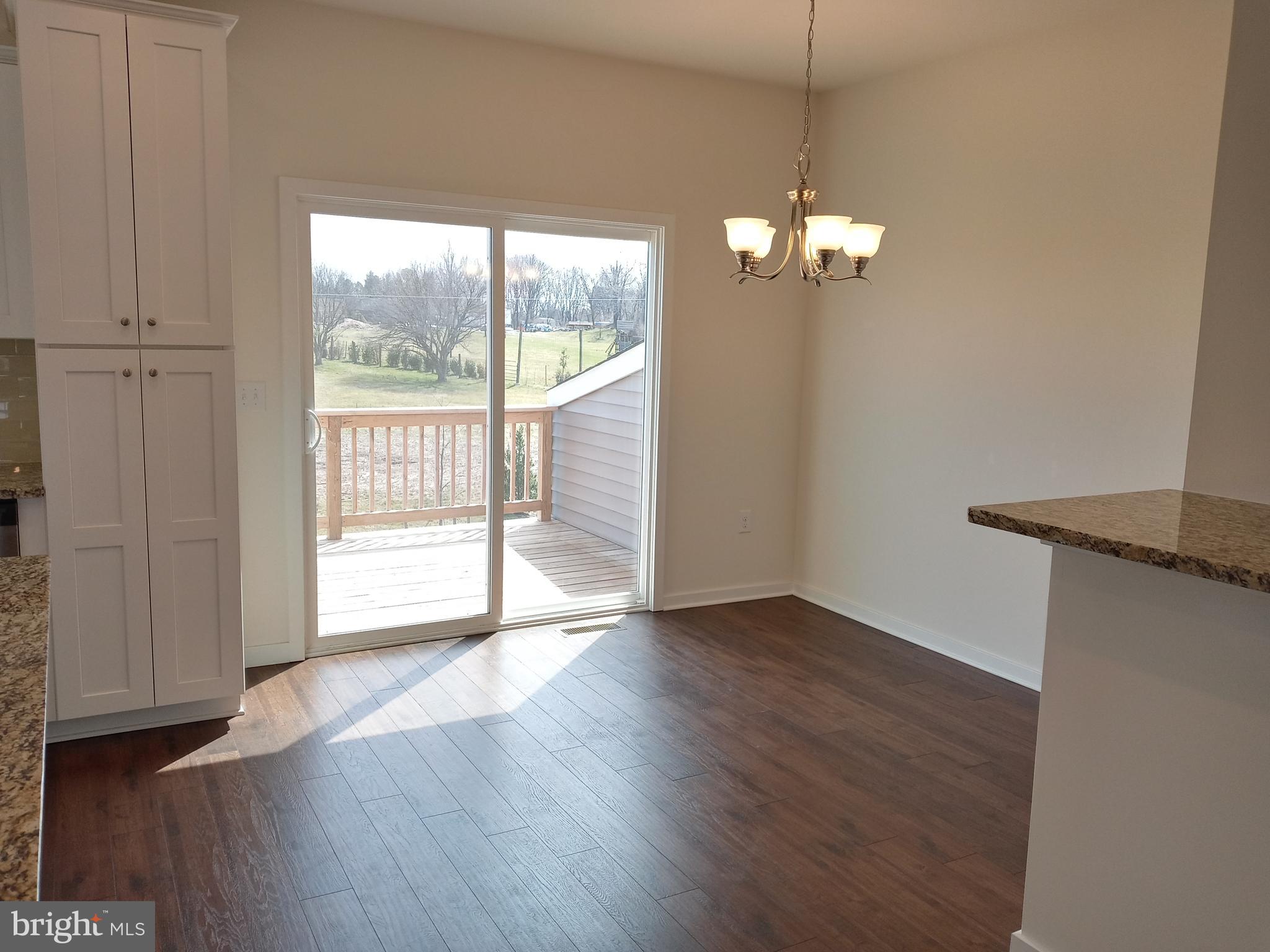 1908 Boulder Drive Downingtown, PA 19335 - Photo 5 of 27 a view of a room with wooden floor and front door