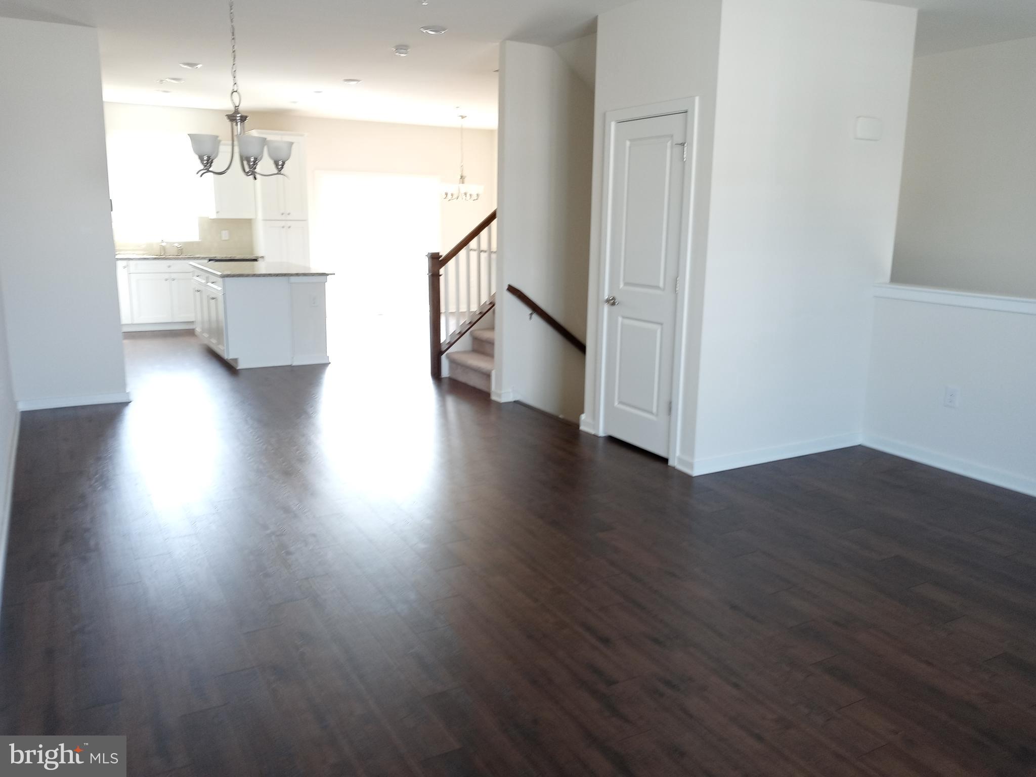 1908 Boulder Drive Downingtown, PA 19335 - Photo 7 of 27 a view of a kitchen with wooden floor and a refrigerator