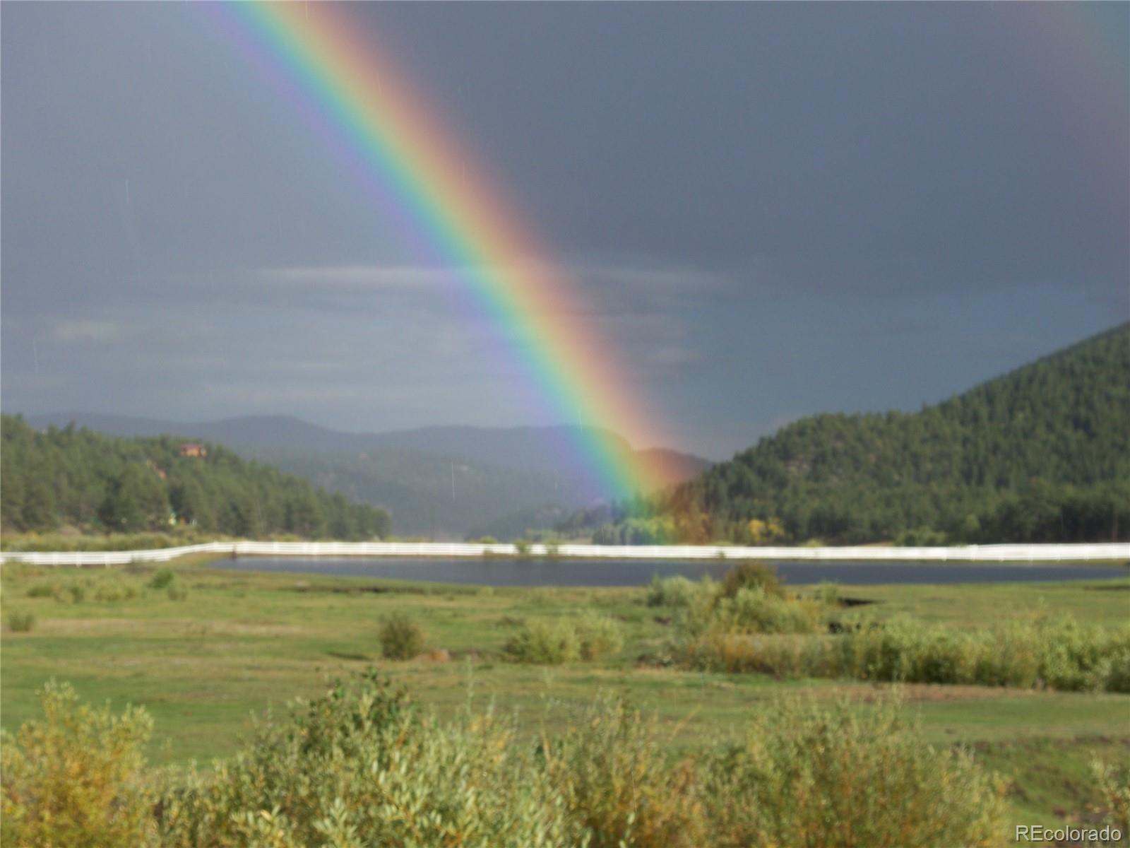 694 Gross Road Bailey, CO 80421 - Photo 13 of 24 a view of swimming pool with outdoor space and seating