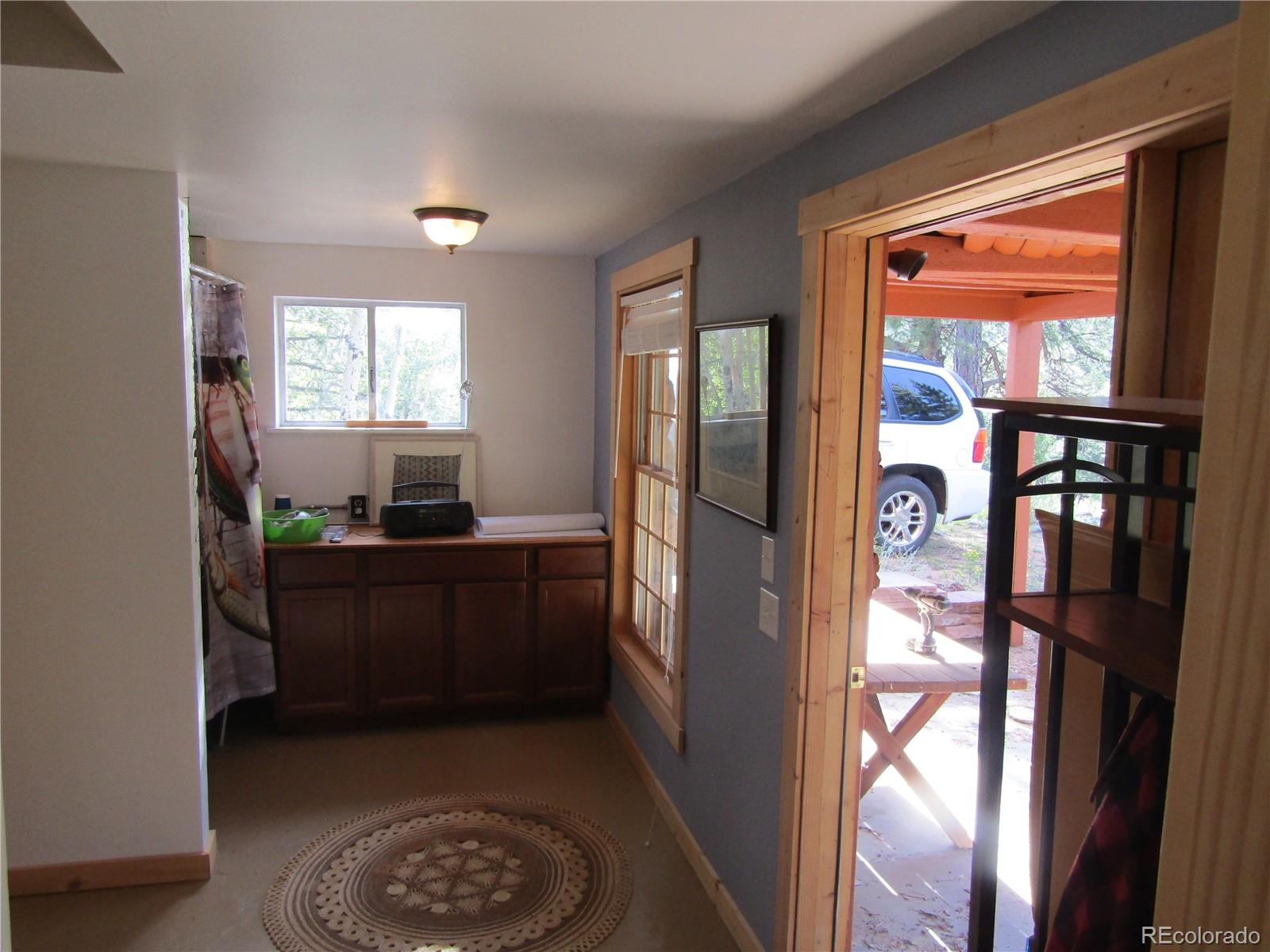 694 Gross Road Bailey, CO 80421 - Photo 24 of 24 a room with a window and a kitchen view
