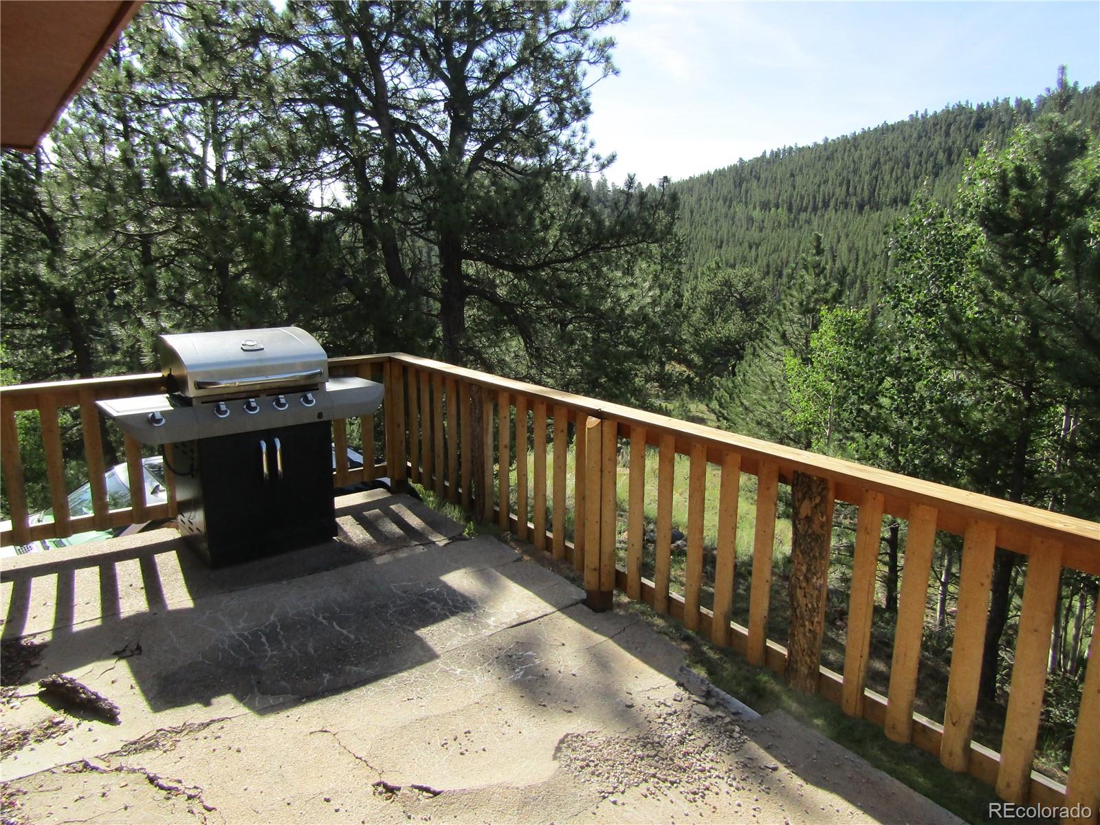 694 Gross Road Bailey, CO 80421 - Photo 7 of 24 a view of a balcony with furniture