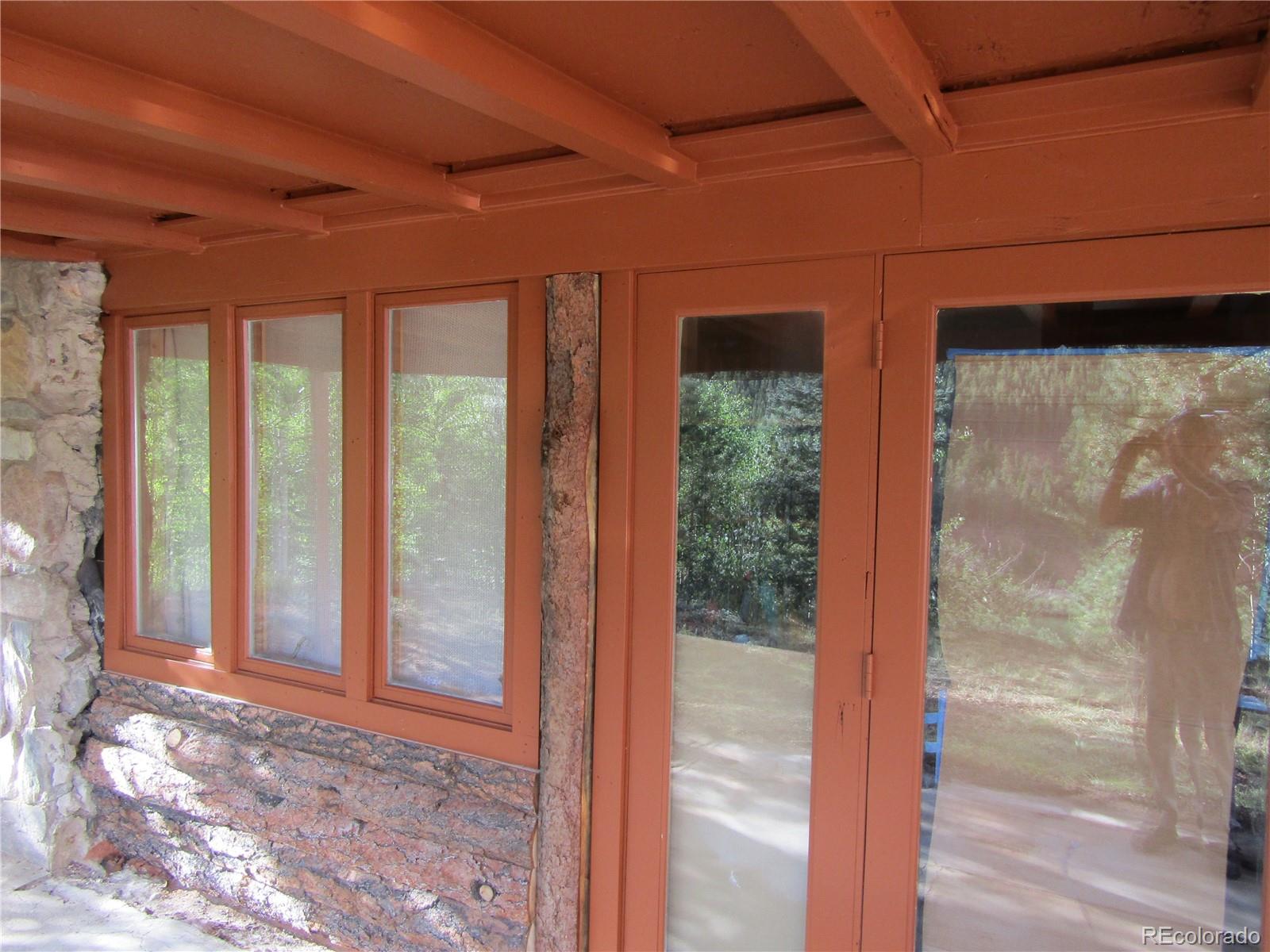 694 Gross Road Bailey, CO 80421 - Photo 8 of 24 a view of a glass door and an entryway