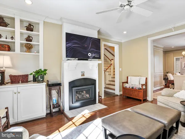 a kitchen with stainless steel appliances a refrigerator a stove a sink dishwasher and a dining table with the kitchen view