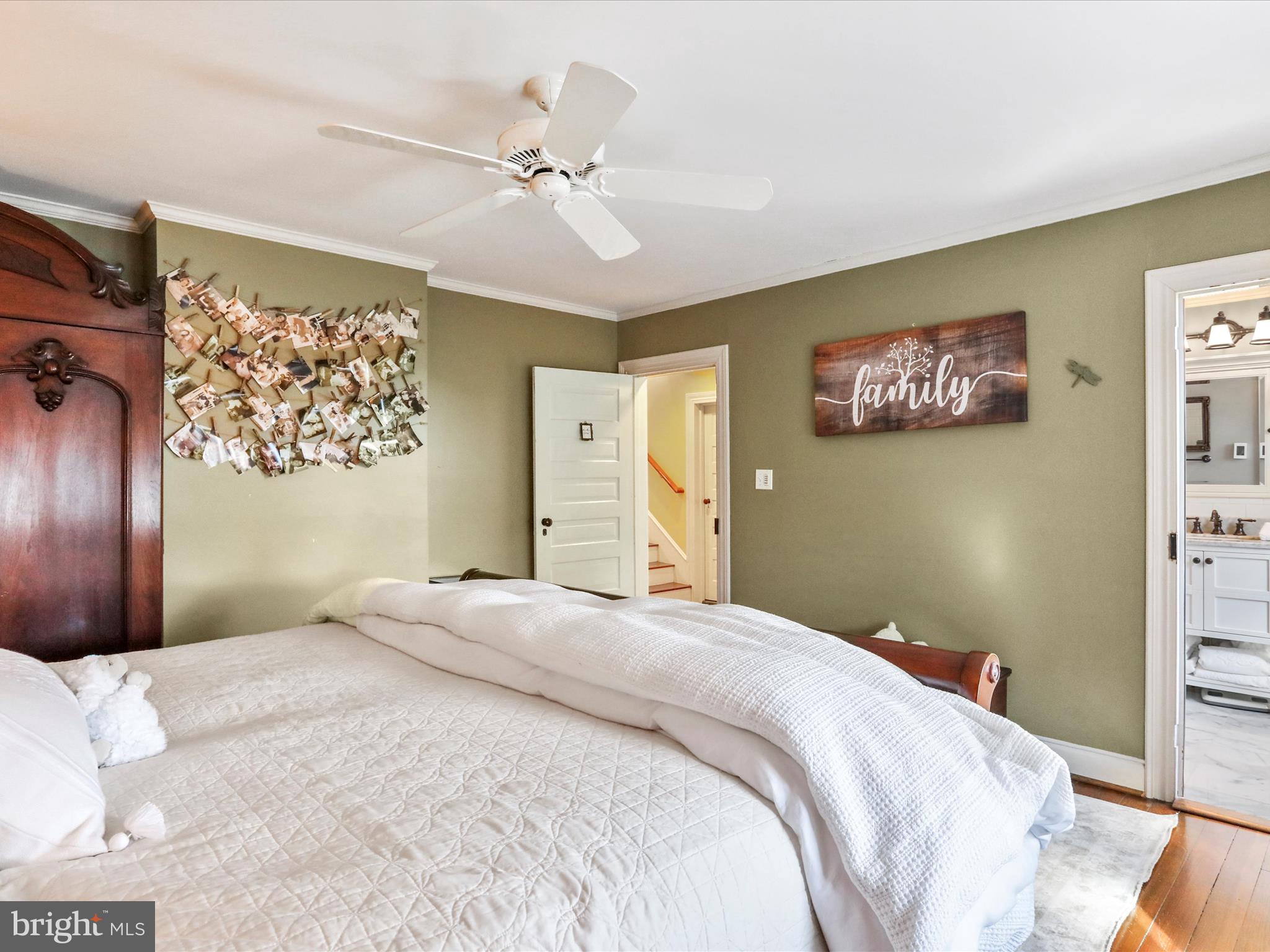 14946 Charmian Road Blue Ridge Summit, PA 17214 - Photo 35 of 56 a bedroom with a large bed and a chandelier