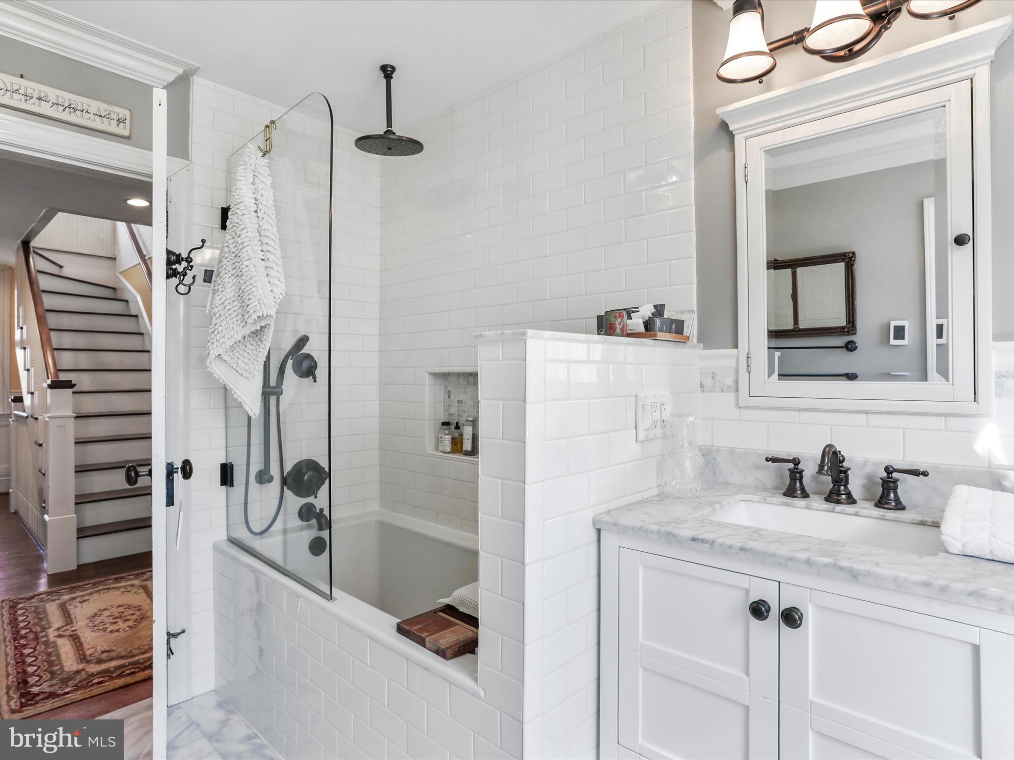 14946 Charmian Road Blue Ridge Summit, PA 17214 - Photo 36 of 56 a bathroom with a tub sink and mirror