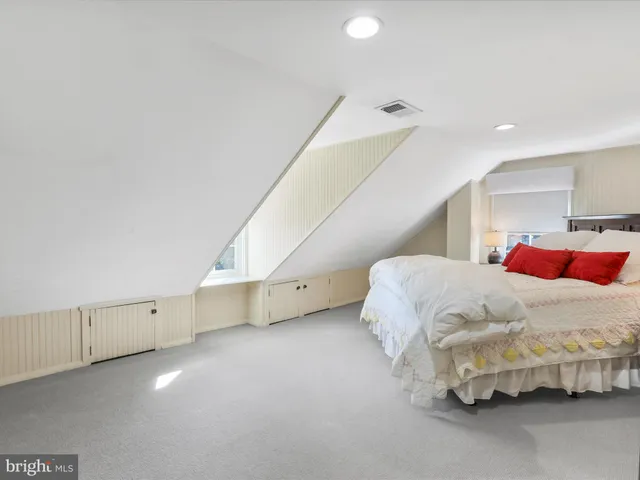 a view of a workspace with furniture and a workspace