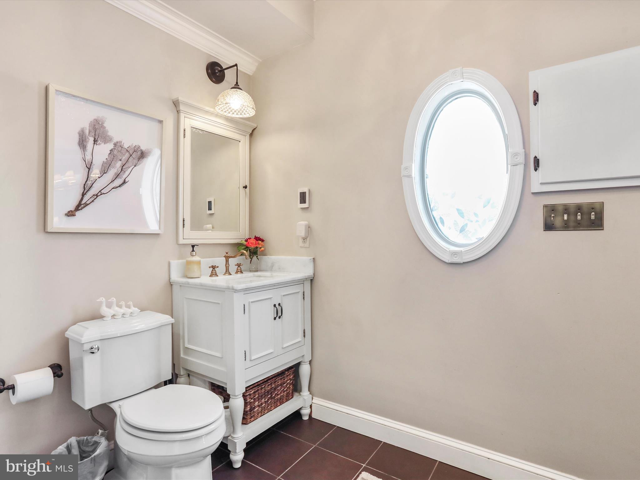 14946 Charmian Road Blue Ridge Summit, PA 17214 - Photo 42 of 56 a bathroom with a toilet a sink and a mirror