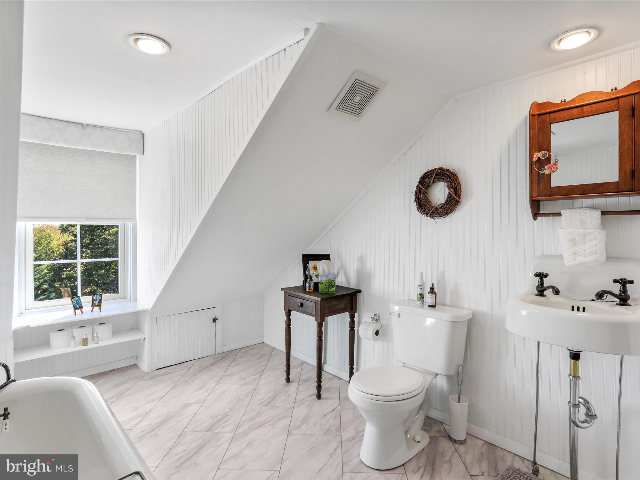 14946 Charmian Road Blue Ridge Summit, PA 17214 - Photo 43 of 56 a bathroom with a toilet a sink and a mirror