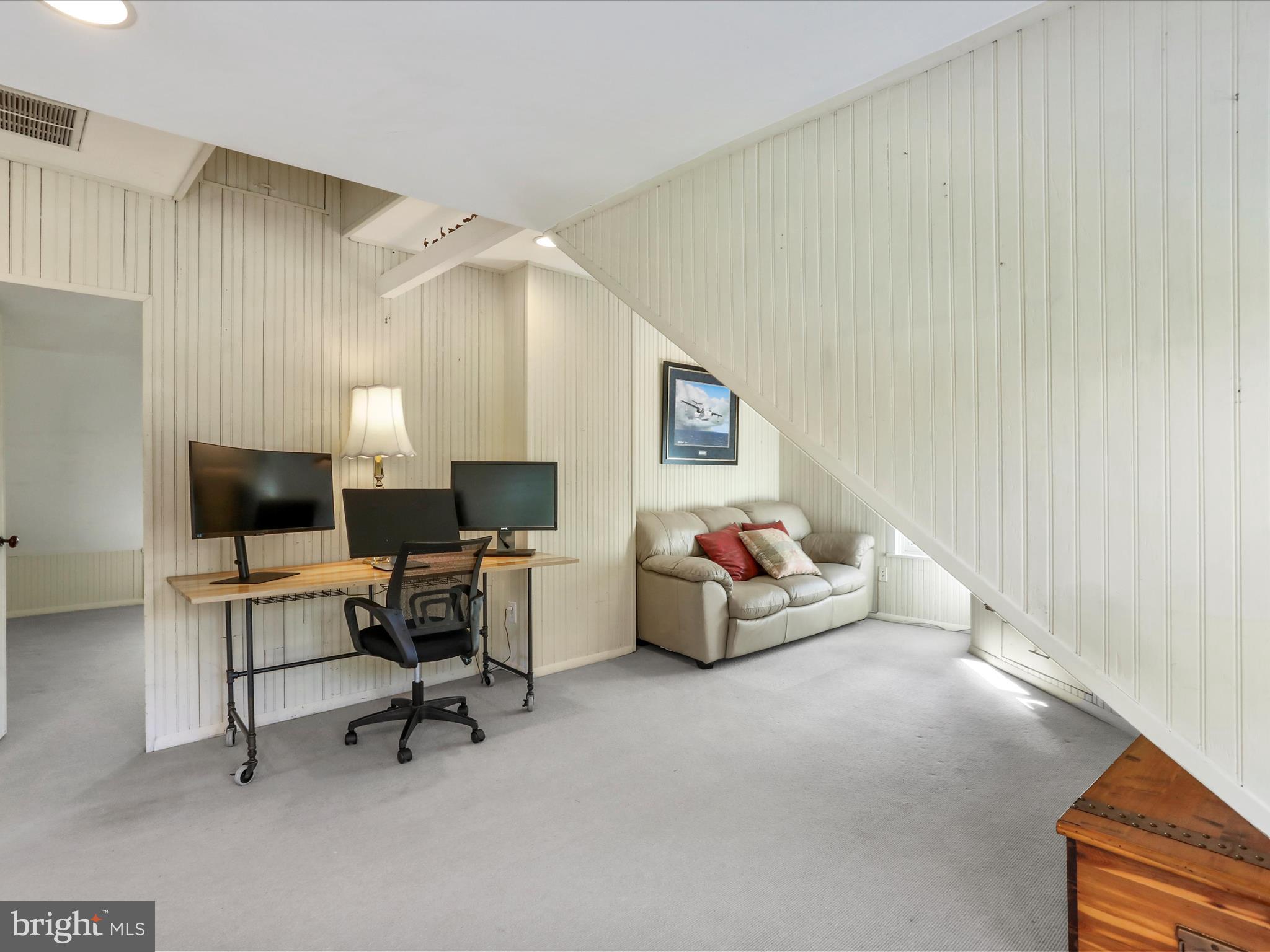 14946 Charmian Road Blue Ridge Summit, PA 17214 - Photo 44 of 56 a living room with furniture and a flat screen tv