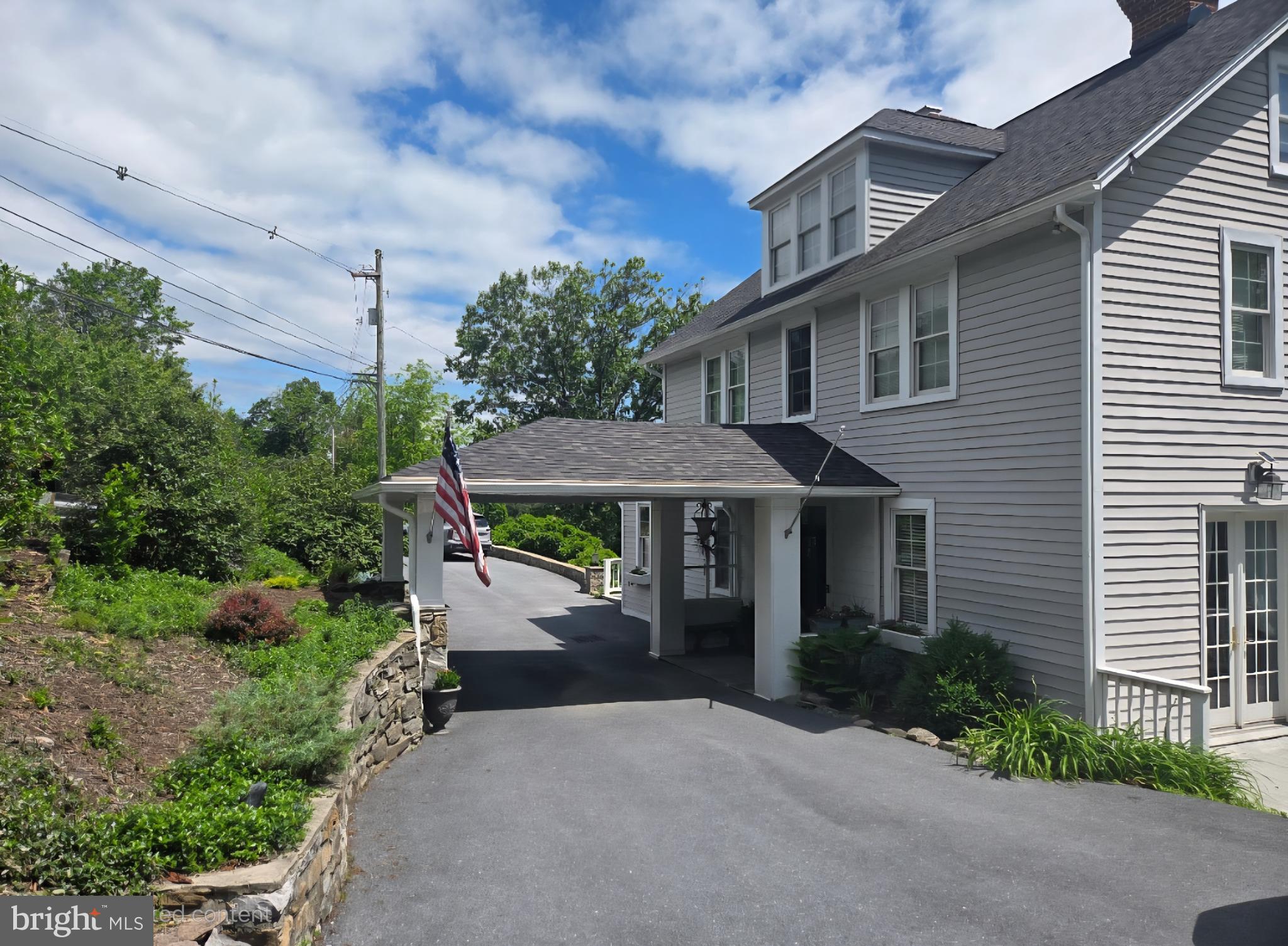 14946 Charmian Road Blue Ridge Summit, PA 17214 - Photo 47 of 56 a front view of a house with a garden and plants