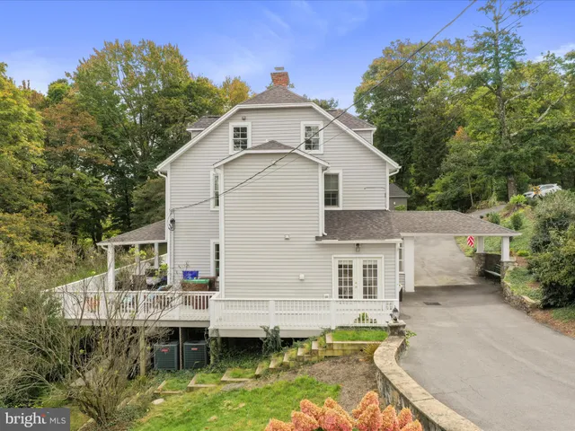 a view of house with a yard outdoor seating and entertaining space