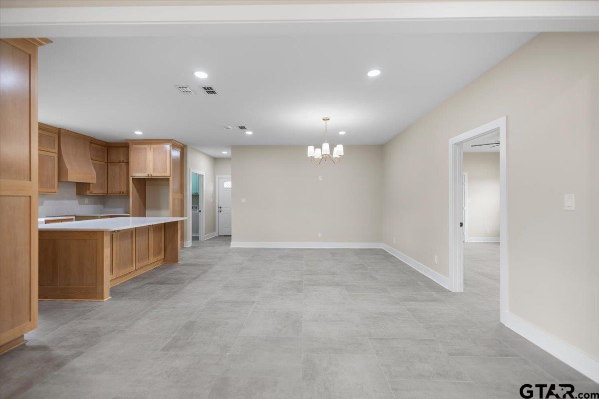 4123 County Road 1120 Tyler, TX 75704 - Photo 11 of 43 a view of kitchen with kitchen island and stainless steel appliances