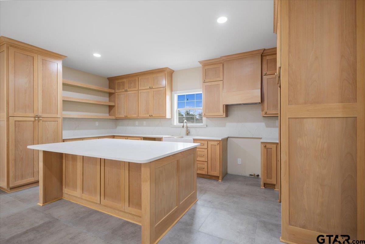 4123 County Road 1120 Tyler, TX 75704 - Photo 14 of 43 a kitchen with a sink stove and refrigerator