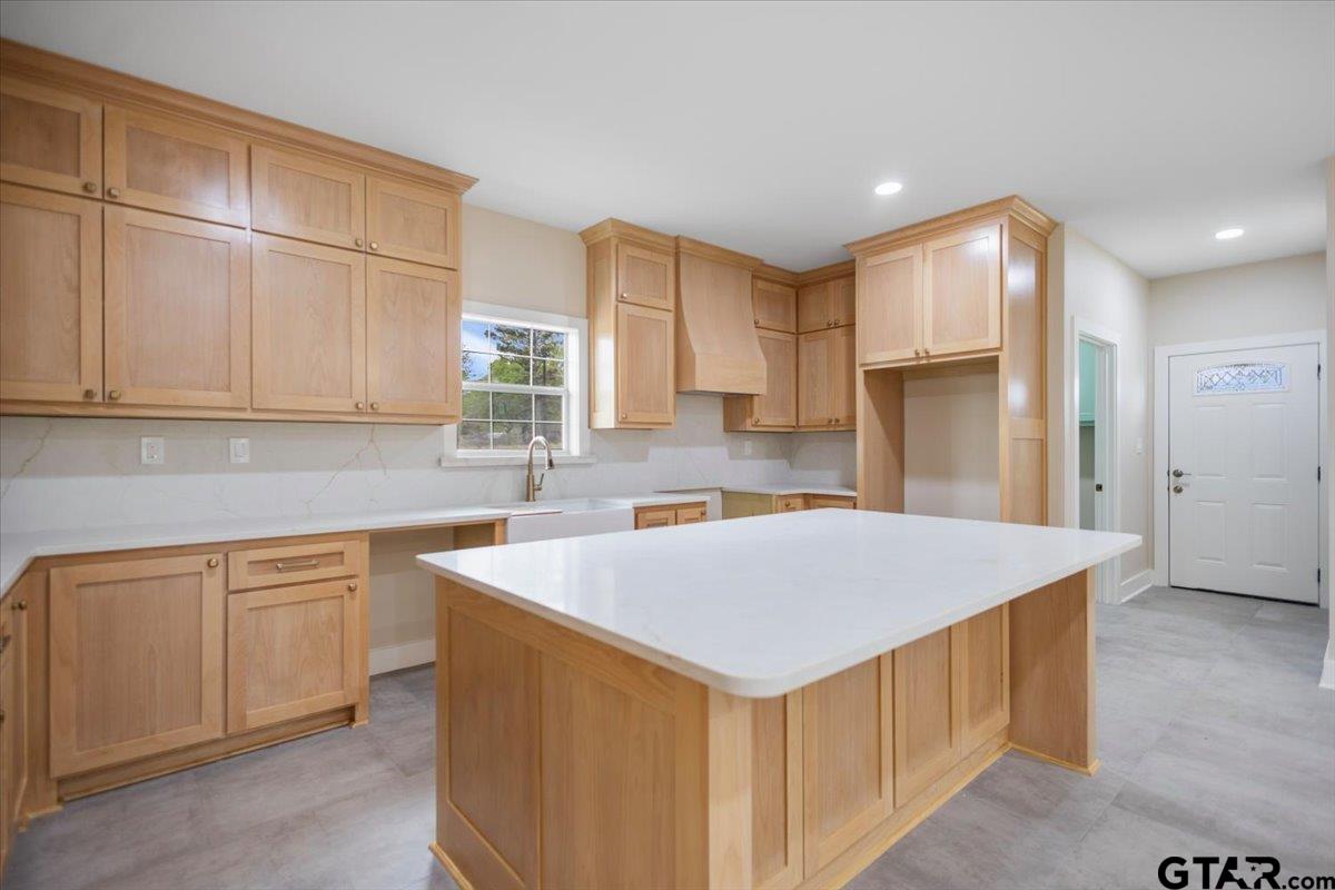 4123 County Road 1120 Tyler, TX 75704 - Photo 15 of 43 a kitchen with stainless steel appliances granite countertop a sink stove and refrigerator