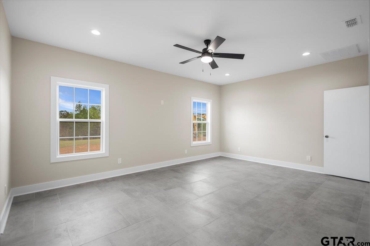 4123 County Road 1120 Tyler, TX 75704 - Photo 24 of 43 a view of a livingroom with a ceiling fan and window